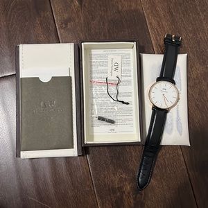 Daniel wellington black leather strap with gold face